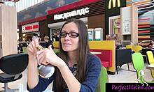 Oiled brunette babe gives public blowjob to stranger and swallows cum at resort