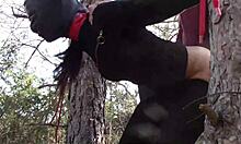 Tied up outdoors in pantyhose for rough action