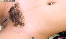 Sexy brunette milf strips down, massages body on sofa during intimate casting photoshoot with amateur charm