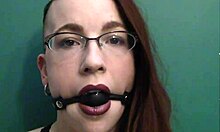 dark lipstick ballgag drooling with intense eye contact