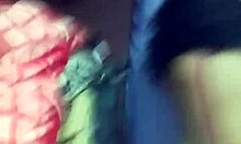 Friends kiss and get put on all fours in a group setting.