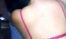 Friends kiss and get put on all fours in a group setting.