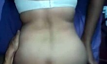 Friends kiss and get put on all fours in a group setting.