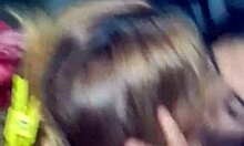 Friends kiss and get put on all fours in a group setting.