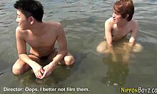 Gay Asian twinks engage in steamy group handjob and blowjob