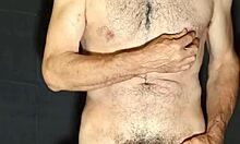 Hey, check out this gay guy showing off his monster cock while jerking off.