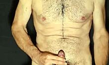 Hey, check out this gay guy showing off his monster cock while jerking off.