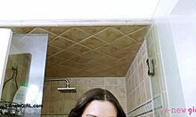 Fierce brunette bombshell takes a refreshing shower after photoshoot