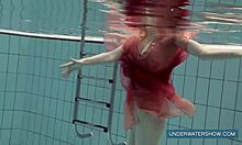 Katya Okuneva stuns in red dress, teasing by the pool with underwater allure