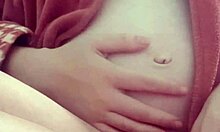 Pregnant Woman Explores Solo Pleasure in Intimate Session