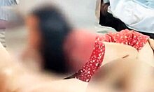 Doña Mary in a stunning red dress after collecting the tanda