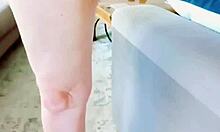 Mature woman gives a close-up view of her legs and intimate area.