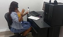 18 years old student in uniform shows off big natural tits while studying computer classes