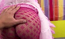 Latina is dancing on the bed looking sexy