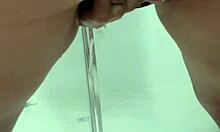 Young teen bends over in bathroom, squirting while exposing juicy ass and asshole.