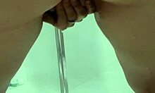 Young teen bends over in bathroom, squirting while exposing juicy ass and asshole.