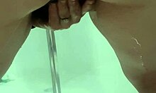 Young teen bends over in bathroom, squirting while exposing juicy ass and asshole.