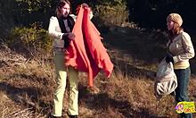 Outdoor picnic turns to lesbian strapon sex for brunette friends.