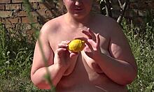 bbw pushes lemon out of hairy pussy