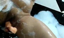 In the motel bathtub, I masturbate and orgasm on the giant dildo.