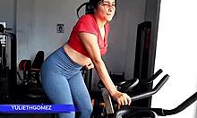 At the gym, I’m giving my stepfather a wild blowjob while trainer watches