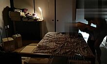 Japanese beauty in stockings finishes with a wild standing handjob.