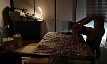 Japanese beauty in stockings finishes with a wild standing handjob.