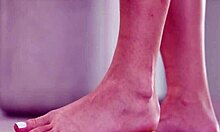 Petite brunette crushes fruits with bare feet