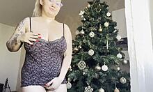big tits BLONDE MASTURBATES near CHRISTMAS tree