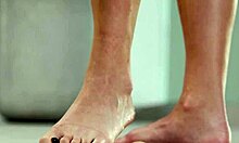 Petite brunette crushes fruits with bare feet