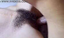 Cum splashes on hairy pussy during intense missionary action.