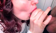 cute redhead gives sloppy public blowjob on balcony. her plump lips work magic outdoors.