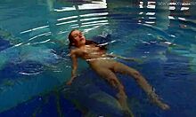 Watch Lina Mercury in red lingerie underwater, showcasing her big tits and tight pussy