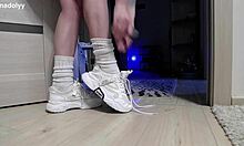 Delicate legs in sneakers wait eagerly for attention