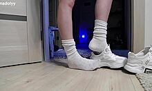 Delicate legs in sneakers wait eagerly for attention