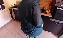 generous girl adjusts her big panties in the kitchen