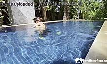 hot babe swims naked and grabs my cock by the pool