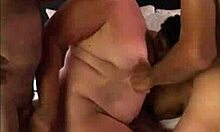 Liz enjoys an intense interracial gangbang with big cocks pounding her ass