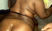Thick ebony amateur deepthroats and gets fucked while wearing fishnets and leash
