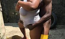 Woman does laundry outside while getting distracted