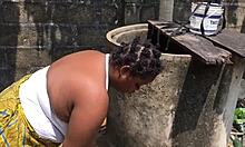 Woman does laundry outside while getting distracted