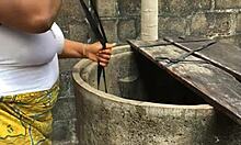 Woman does laundry outside while getting distracted