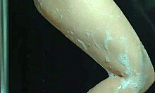 college babes lather up in a steamy shower with big bouncing assets