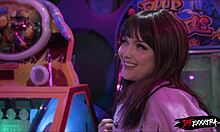 Blonde teen gets fucked doggystyle by big black cock in arcade.