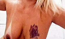 In the bathroom, she inserts a dildo into her pussy