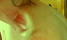 Cougar wife teases tits with sensual handjob.