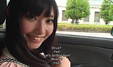 Japanese Teen Enjoys a Ride on the Car