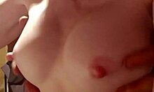 Cougar wife teases tits with sensual handjob.