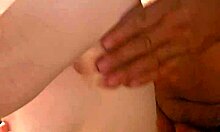 Cougar wife teases tits with sensual handjob.