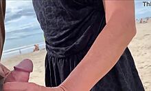 I'm cumming right in front of everyone at the beach again. People are staring while I blow this huge cock with my tits out!